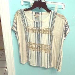 Striped shirt with golden accents